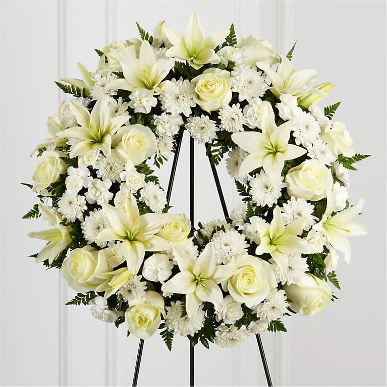 Eternal Peace Wreath - all-white standing funeral wreath with lilies, roses, chrysanthemums and ferns on an easel