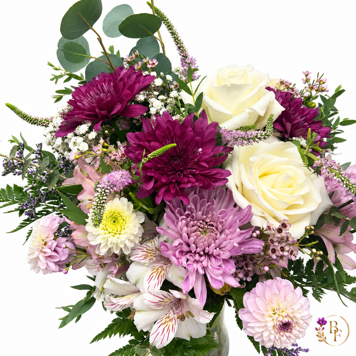 Close-up of ivory roses, plum and lavender blooms, delicate seasonal flowers and eucalyptus in the Lavender & Plum arrangement